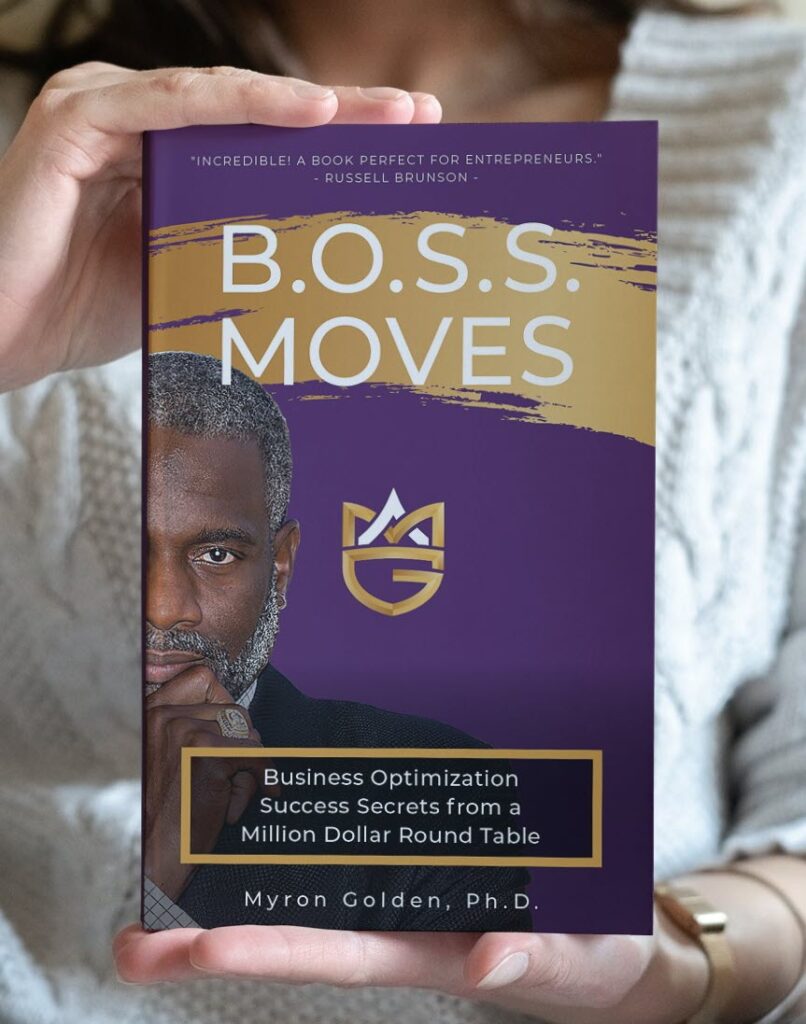 woman holding BOSS Moves book